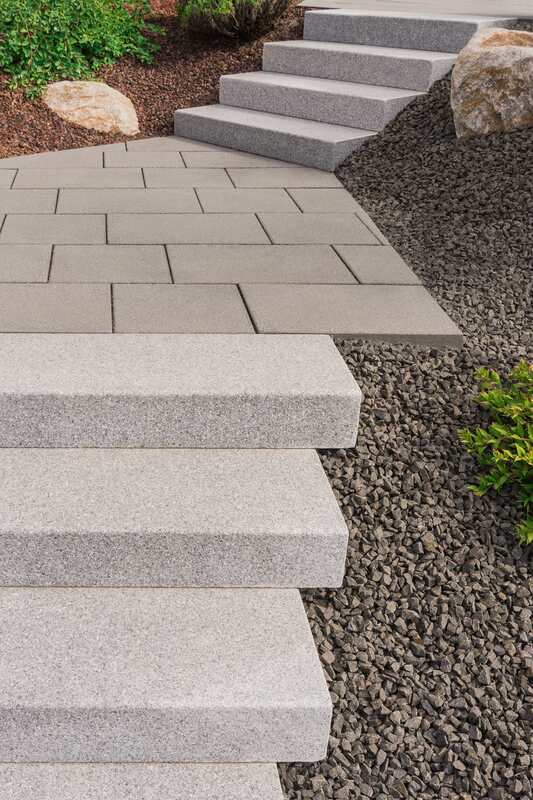 This photo was taken when we were called in for a landscaping project. We installed an exposed aggregate and stamped concrete stair set for our Langley based client.